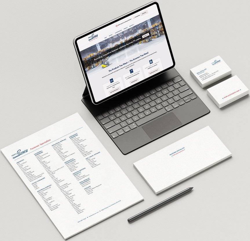 Portland-screw-collateral-cropped Digital marketing agency branded stationery and tablet displaying web design, emphasizing front-end development and UX/UI.